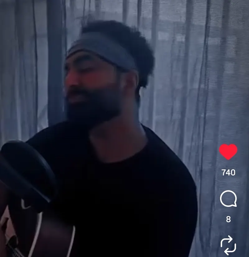 Aakash singing with guitar - reel one